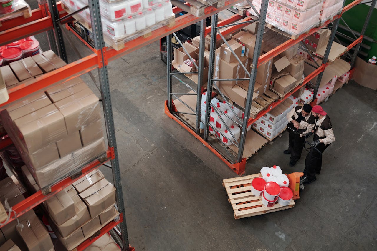 Crafting Captivating Headlines: Your awesome post title goes here Workers managing inventory on shelves in a warehouse, viewed from above.
